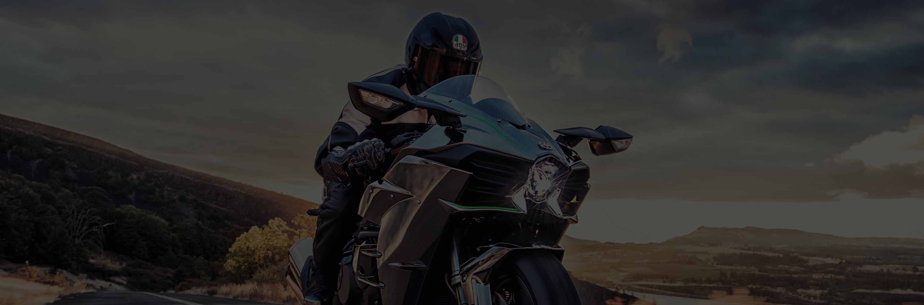 Kawasaki Ninja motorcycle driving in the sunset