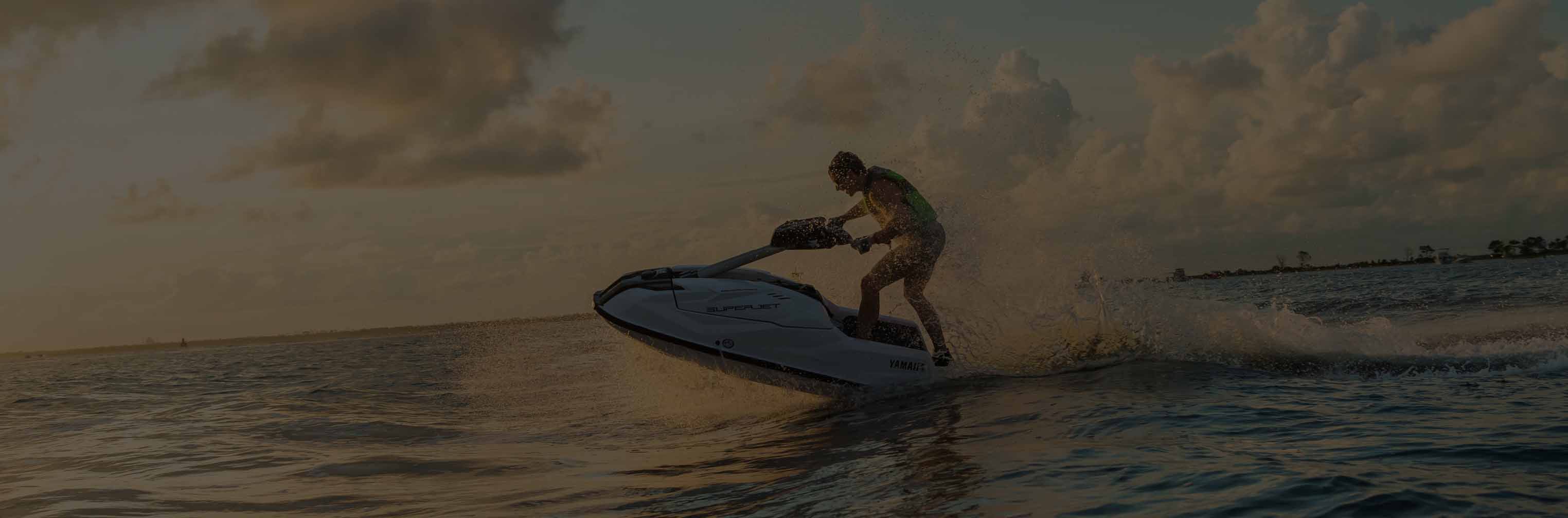Yamaha Waverunner jumping waves in the sunset