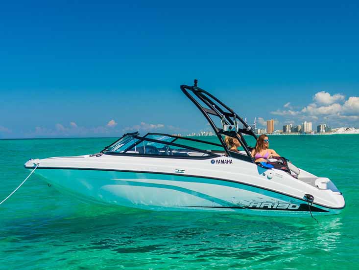 Yamaha Boat anchored on a sandbar with couple relaxing