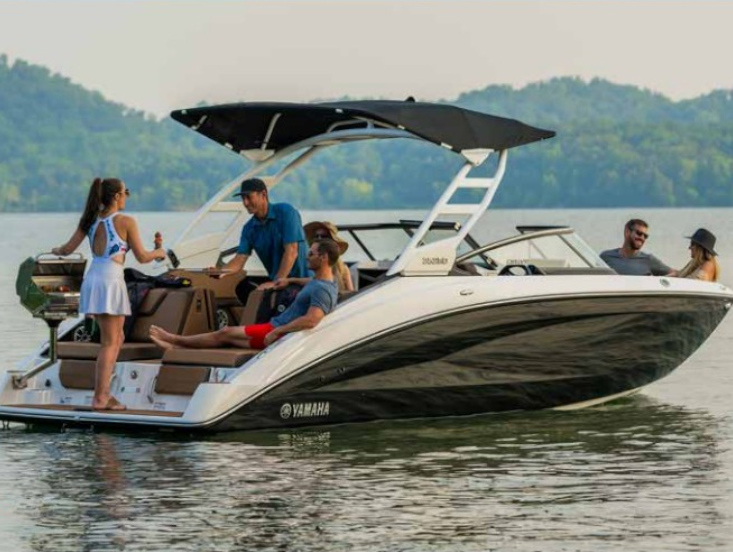 Yamaha boat anchored on a sandbar with people relaxing