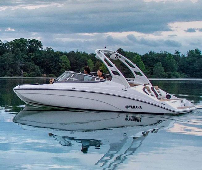 Yamaha jet propulsion boat with family inside cruising