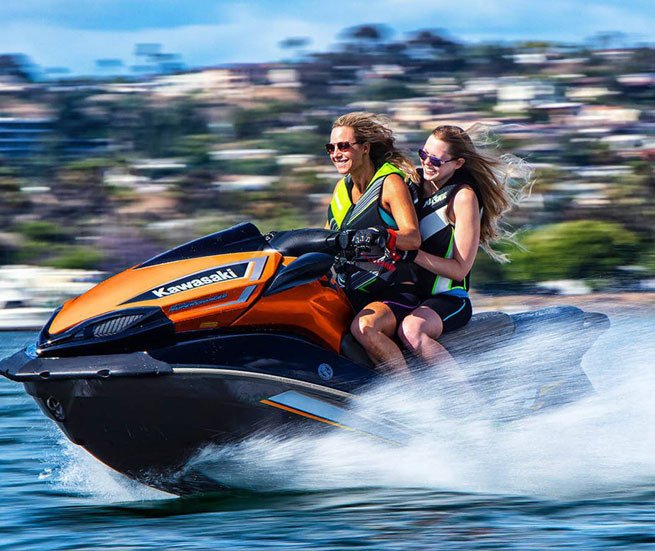 Kawasaki supercharged personal watercraft with young couple