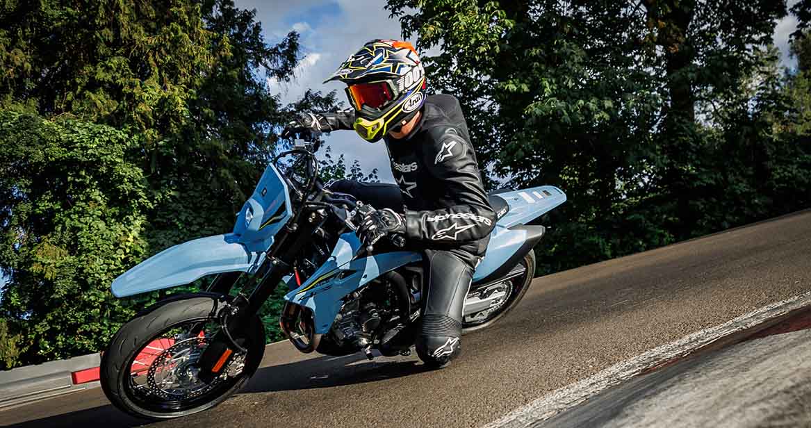 Motorcycle rider taking corner around race track