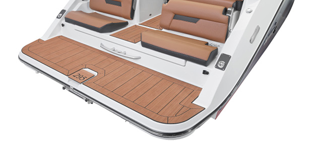 Spacious teak-style swim platform with integrated steps and flush seating at the rear of the Yamaha 295 Series.
