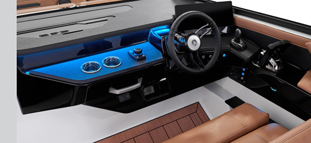 Illuminated helm of the Yamaha 295 Series showcasing modern controls, backlit cupholders, and leather captain’s chair