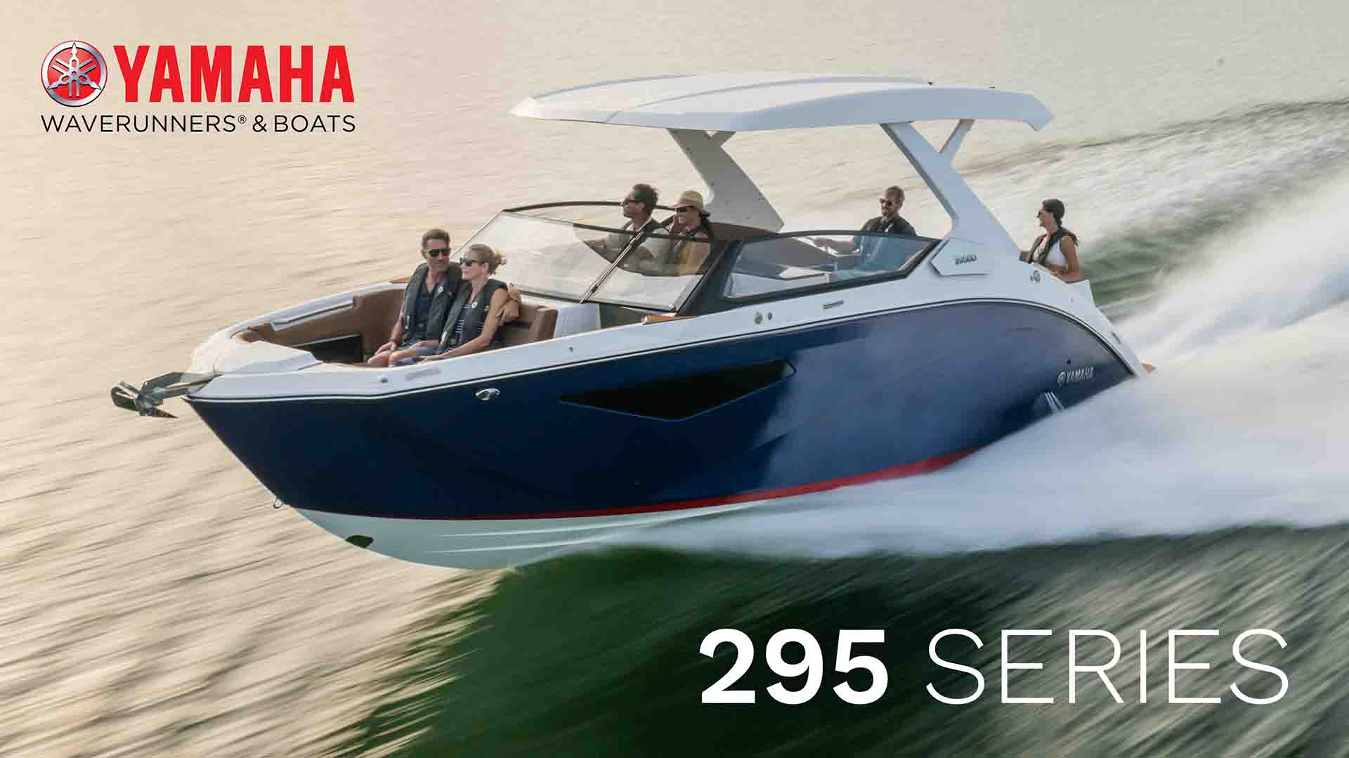 Yamaha 295 Series boat speeding across the water with six passengers enjoying the ride under a sleek white hardtop
