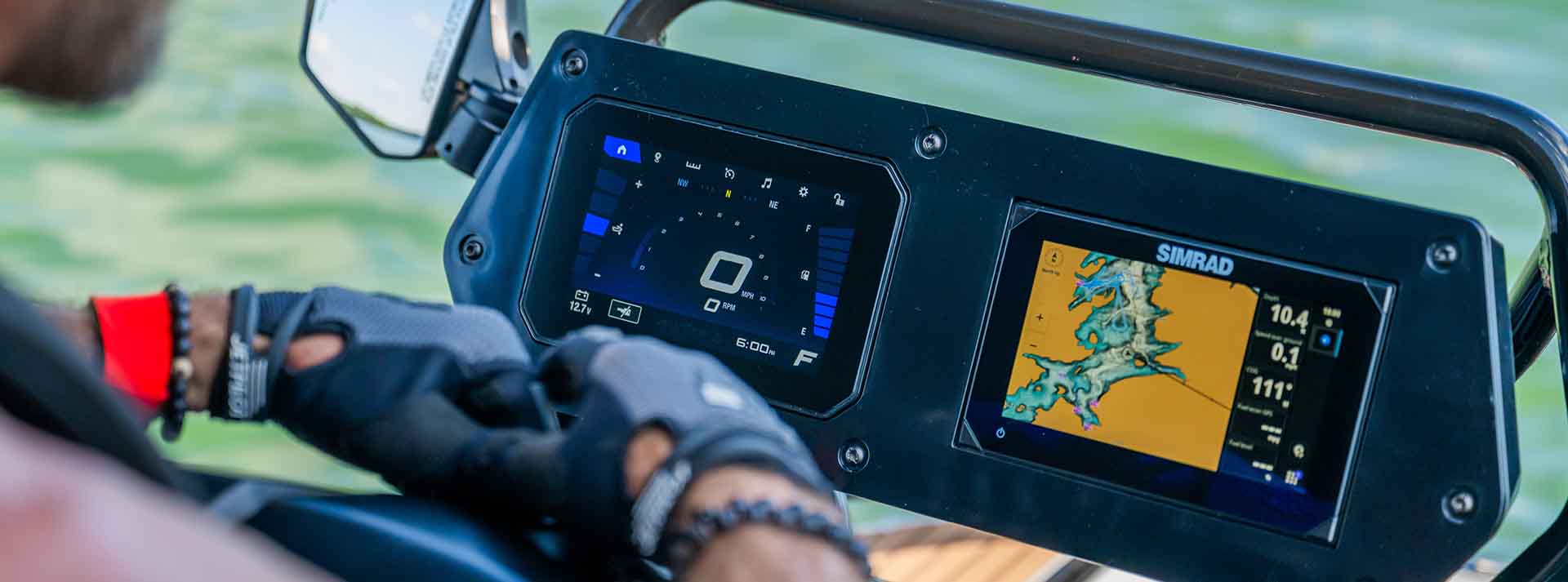 Close-up of the Yamaha Crosswave digital dash display showing speed, RPM, and fuel levels on one screen, alongside a Simrad marine GPS with a detailed waterway map.